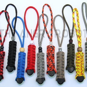 May include: Ten colorful paracord keychains with different bead accents. Each keychain has a black fire starter attached to the end.