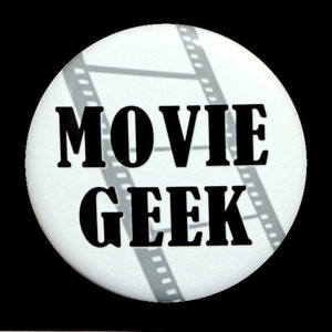 May include: White button with black text that reads "MOVIE GEEK" and a film strip pattern in the background.