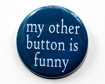 May include: A blue button with white text that reads "my other button is funny".