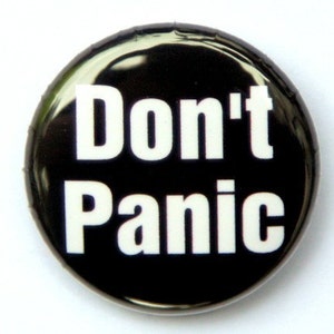 File:Don't Panic Badge.jpg - Wikimedia Commons