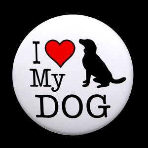 May include: White button with a black silhouette of a dog and a red heart. The text "I Love My Dog" is printed in black.