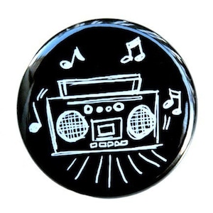 May include: A black and white illustration of a boombox with music notes on a black background.