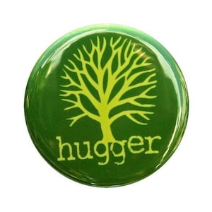 May include: Green button with a yellow tree design and the word "hugger" in yellow letters.