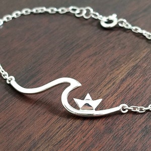 ONDE ANOMALE - bracciale in argento 925 con un'onda e una barchetta di carta