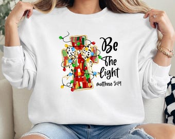 Felpa natalizia Be The Light, maglietta con Scritture cristiane