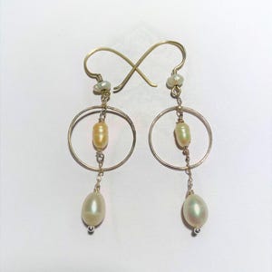 Earrings Sterling silver with freshwater pearls . Dangle earrings.