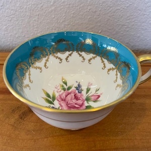 Vintage Aynsley bone china teacup with rose detail