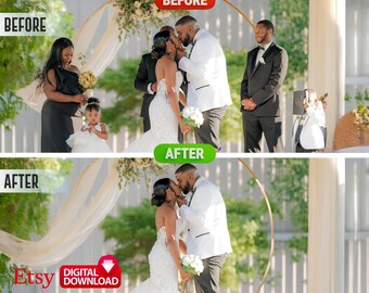 May include: A wedding ceremony with the bride and groom kissing under a floral archway. The bride is wearing a white wedding dress and the groom is wearing a white tuxedo. A flower girl is standing in the background.