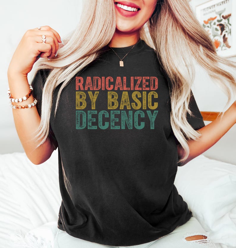 May include: A black t-shirt with a vintage-style graphic that reads "Radicalized by Basic Decency".