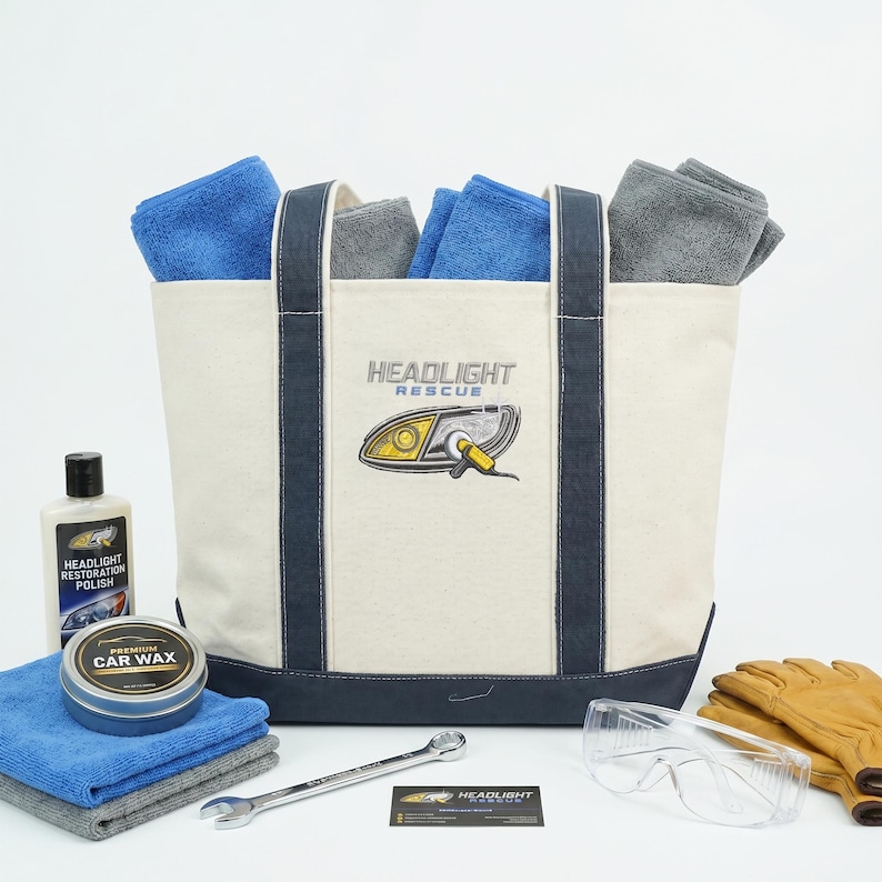 Custom logo canvas tote bag with headlight repair branding, filled with car care products, microfiber towels and tools, promotional business gift bag