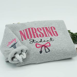 NURSING STUDENT Embroidered Hoodie, Bow Stethoscope, Nursing Sweatshirt, Embroidered Sweatshirt, Nursing School Gift Crewneck