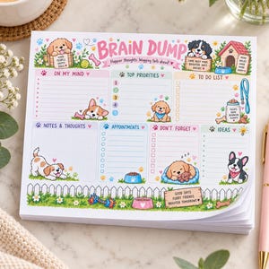 May include: A rectangular paper notepad titled Brain Dump with colorful illustrations of puppies, dog houses, and paw prints. The layout includes sections for On My Mind, Top Priorities, To Do List, Notes & Thoughts, Appointments, Don't Forget, and Ideas.