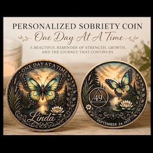May include: Two round sobriety coins featuring a butterfly, a lotus flower, and a landscape scene. The left coin displays the text 'ONE DAY AT A TIME' and 'Linda'. The right coin shows the number '49' inside a triangle and 'SEPTEMBER 24, 1977'.