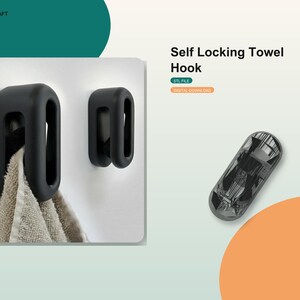 Op de afbeelding: Twee matzwarte, ovaalvormige zelfsluitende handdoekhaken gemonteerd aan een muur. Eén haak houdt een beige textuurhanddoek vast. De tekst luidt LCD CRAFT, Self Locking Towel Hook, STL FILE en DIGITAL DOWNLOAD. Een grijs ovaal object is ook zichtbaar.