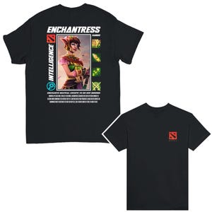 May include: Black t-shirt with a graphic of a female character from the video game Dota 2. The character is holding a staff and has green hair and a pink and green outfit. The text "Enchantress" and "Intelligence" are printed on the shirt.