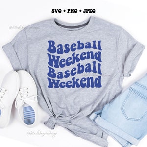 May include: A grey t-shirt with the text "Baseball Weekend" repeated twice in a blue retro font.