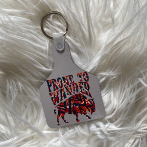 Prone to Wander Cow Tag Keychain