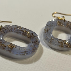 Periwinkle and gold resin dangling earrings