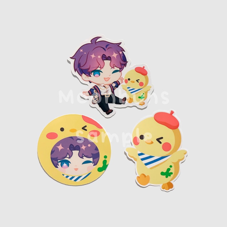 May include: Set of three stickers featuring anime-style characters. One sticker shows a purple-haired character with a chick. Another sticker is a yellow circle with a character's face inside. The third sticker is a yellow chick with a red beret.