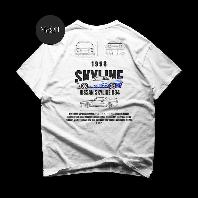 May include: White t-shirt with a blue and white Nissan Skyline R34 graphic print. The text "1998 SKYLINE" is printed above the car. The text "NISSAN SKYLINE R34" is printed below the car. The text "The Nissan Skyline (Japanese: 日産スカイライン, Nissan Sukairain) is a brand of automobile originally produced by the Prince Motor Company starting in 1957, and then by Nissan after the two companies merged in 1967." is printed below the car.