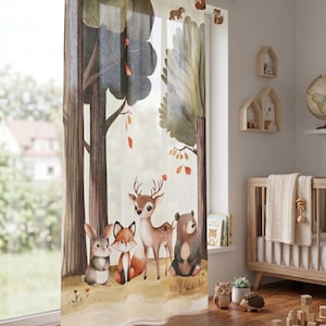 May include: A sheer window curtain featuring a printed forest scene with a watercolor-style illustration of a rabbit, a fox, a deer, and a bear standing together. The design includes tall trees with green and brown foliage and falling leaves.