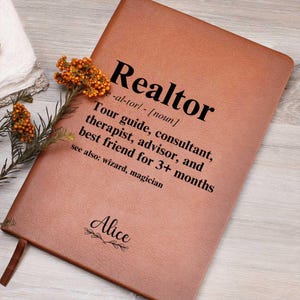 May include: A brown leather journal with the word "Realtor" defined as "Tour guide, consultant, therapist, advisor, and best friend for 3+ months." The name "Alice" is written below the definition.