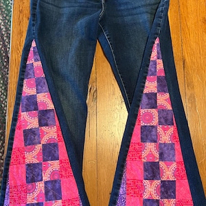 Upcycled Womens Jeans with a Hand Quilted Purple and Pink QuiltedFlare.  Jeans are Womens Lucky size 14