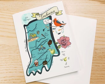 May include: A colorful illustrated map of Indiana, the "Hoosier State", with the state's nickname, "The Crossroads of America", and the state bird, the cardinal, depicted. The map includes major cities, landmarks, and a compass rose.