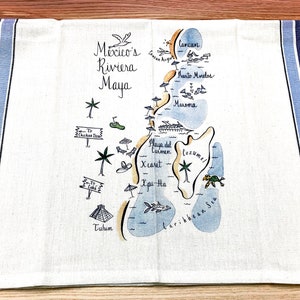 May include: A white kitchen towel with blue stripes features a hand-drawn map of Mexico's Riviera Maya. The map includes locations like Cancun, Playa del Carmen, Cozumel, and Tulum. The towel is ideal for adding a touch of coastal charm to your kitchen.