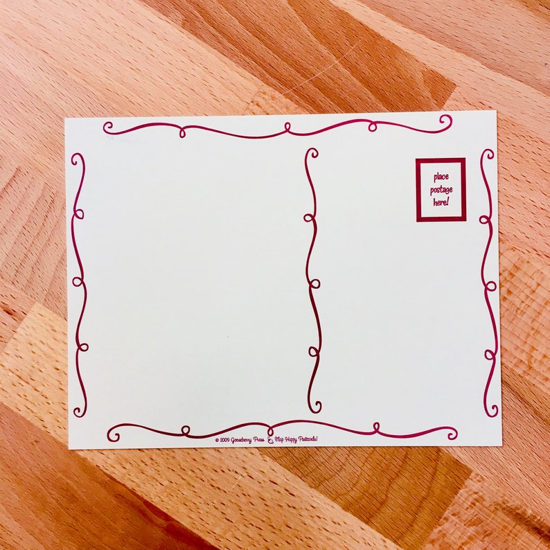May include: A white postcard with a red border. The border is made of a series of swirls. The postcard has a space for a stamp in the upper right corner. The text "place postage here!" is printed in a red box.
