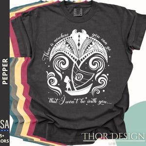 May include: A dark gray t-shirt with a white graphic design of a boat sailing through waves. The text "There is nowhere you can go that I won't be with you..." is printed on the shirt.