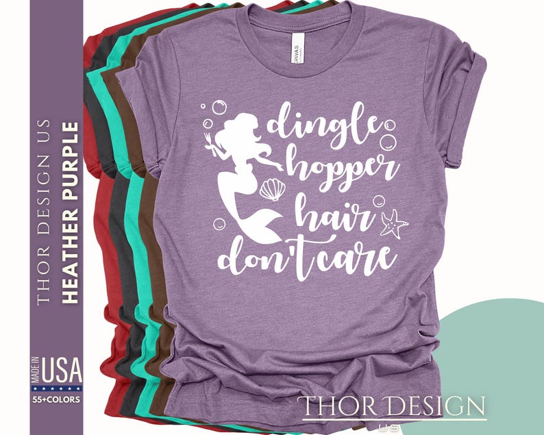 May include: Purple t-shirt with a white graphic of a mermaid with the text "dingle hopper hair don't care".