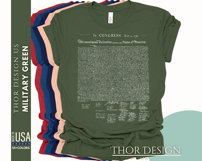 May include: A green t-shirt with the text "In Congress, July 4, 1776" and the full text of the Declaration of Independence printed on the front. The text is in white and the t-shirt is a military green color.