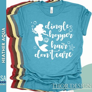May include: A turquoise blue t-shirt with a white silhouette of a mermaid with the text "dingle hopper hair don't care".