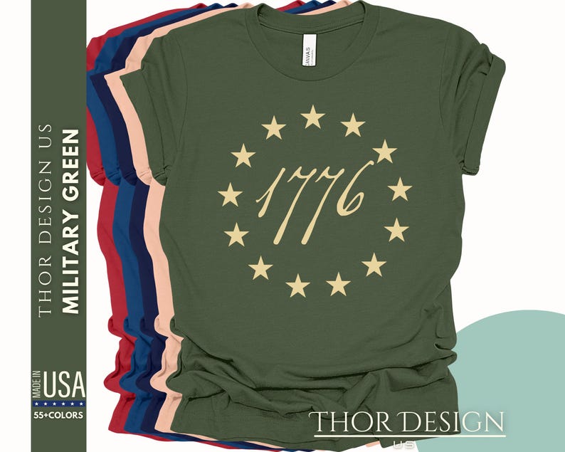 May include: A green t-shirt featuring a circle of stars and the text "1776" in gold. The shirt is available in a range of colours.