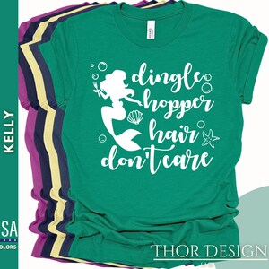 May include: Green t-shirt with a white mermaid graphic and the text "dingle hopper hair don't care".