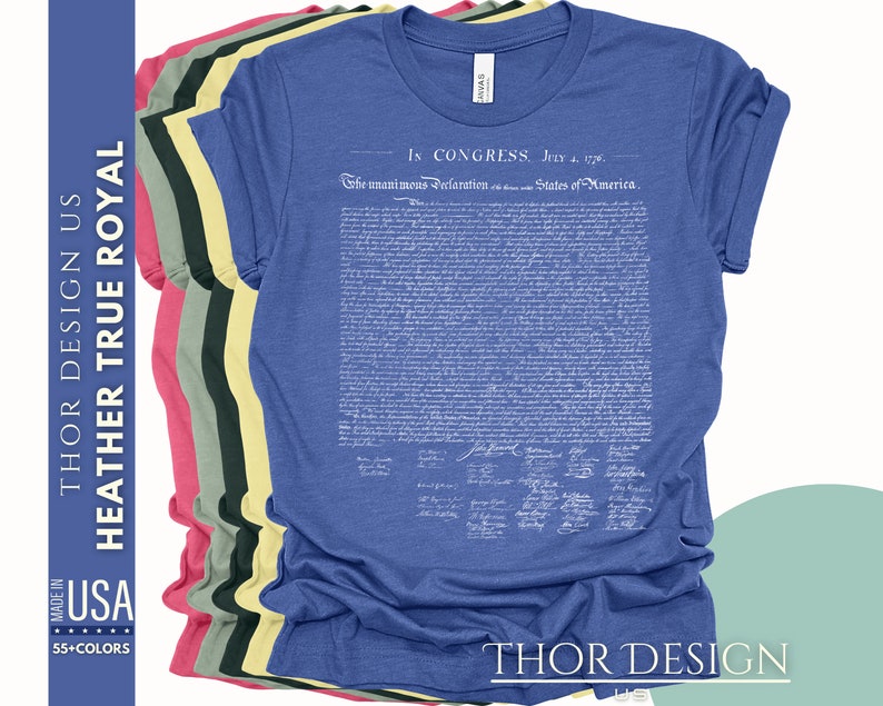 May include: A blue t-shirt with the full text of the Declaration of Independence printed in white. The text includes the date "July 4, 1776" and the signatures of the founding fathers. The shirt is available in a variety of colors.
