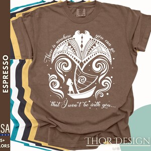 May include: A brown t-shirt with a white design of a boat sailing through waves. The design includes the text "There is nowhere you can go that I won't be with you..."