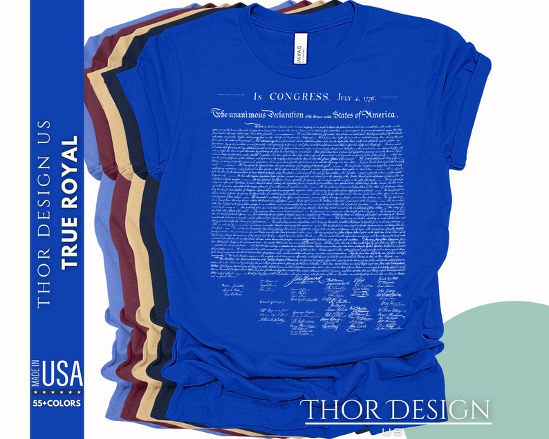 May include: A blue t-shirt with the text "In Congress, July 4, 1776. The unanimous Declaration of the thirteen united States of America." printed on the front. The text is in white and is a replica of the Declaration of Independence.