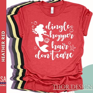 May include: Red t-shirt with a white graphic of a mermaid with the text "dingle hopper hair don't care".