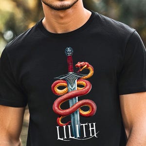 Lilith Occult Serpent Sword Shirt, Gothic Warrior Magic Tee, Mythology Snake Print, Dark Fantasy Pagan Blade Design, Mystic Gothic Gift Top