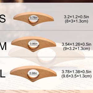 May include: Three wooden thumb page holders in sizes S, M, and L. Each has a finger hole and is designed to hold pages open. Measurements are provided in inches and centimeters.