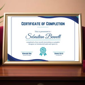 May include: A certificate of completion with a blue and white design, awarded to Sebastian Bennett for completing a four-month internship as a graphic designer at SrimberioFradel and Spies Co.
