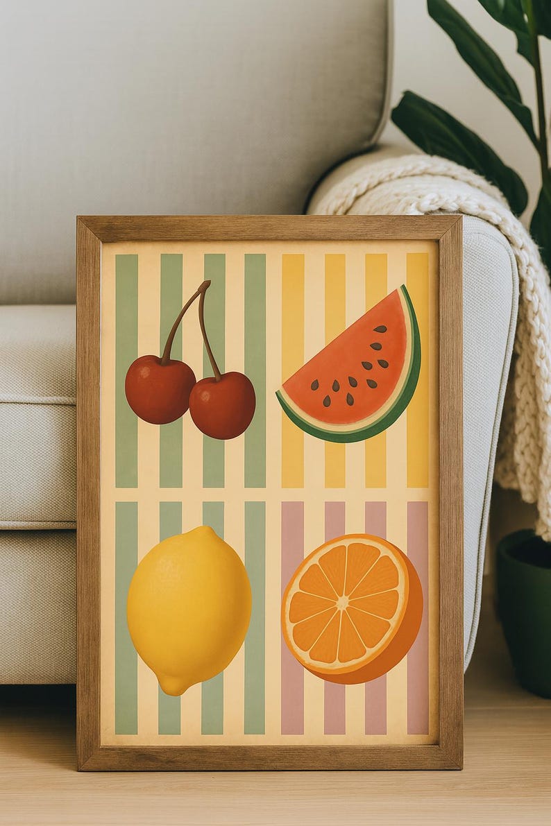 May include: A framed print featuring a retro-style illustration of fruits. The artwork includes cherries, a watermelon slice, a lemon, and an orange half, set against a striped background in pastel colors. The frame is made of wood.
