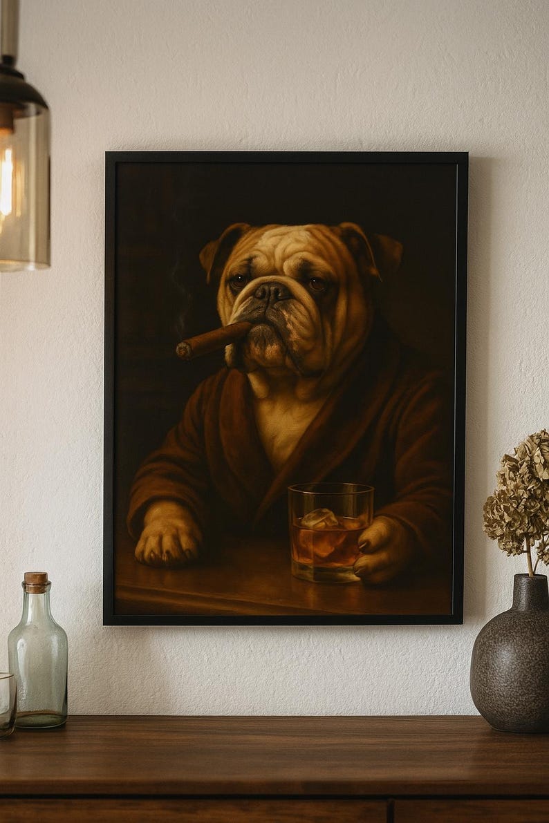 May include: Framed artwork featuring a distinguished bulldog in a brown robe, smoking a cigar, and holding a glass of whiskey with ice. The artwork has a dark background and is displayed in a black frame.