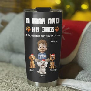 May include: Black stainless steel tumbler with the text "A MAN AND HIS DOGS" and the phrase "A bond that can't be broken." The tumbler features a cartoon illustration of a man and three dogs, each wearing a Santa hat. The names Oreo, Max, and Tucker are below the dogs.