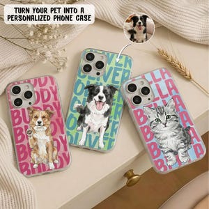 May include: Three personalised phone cases featuring illustrations of pets. One case has a brown and white dog with the name Buddy, one has a black and white dog with the name Oliver, and one has a grey tabby kitten with the name Bella printed repeatedly.