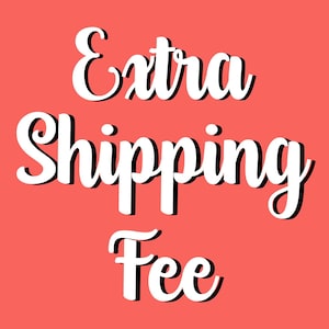 May include: A coral-colored background with the words "Extra Shipping Fee" in a white, cursive font with a black shadow effect. The text is centered and takes up most of the image.