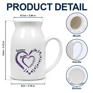 May include: White ceramic mug with a large handle, featuring a purple heart design with the words "Grammie Mama" and names. The mug is 5.12 inches tall and 3.15 inches wide.
