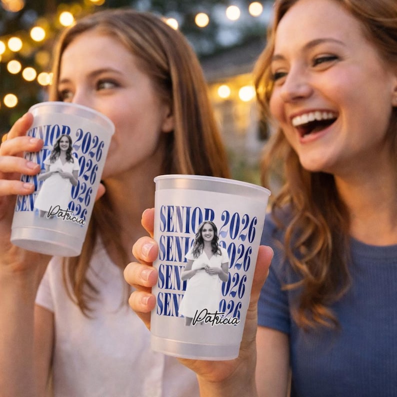 May include: Two clear plastic cups with a blue design that says "SENIOR 2026" and a photo of a woman in a white dress. The name "Patricia" is printed on the bottom of the cup.